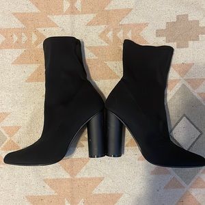 Skintight black ankle booties